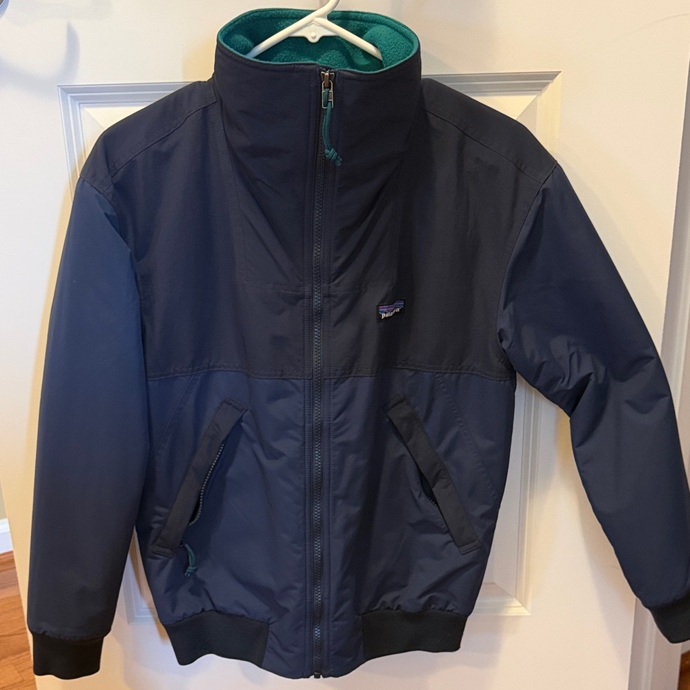 Women’s XS Patagonia navy jacket with teal lining LIKE NEW